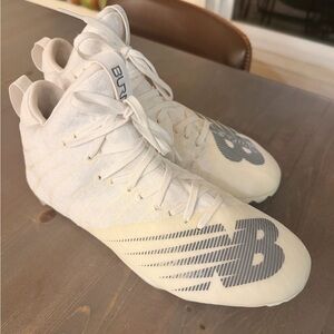 New Balance burn LACROSSE cleates. White and Gray High-Top cleates.